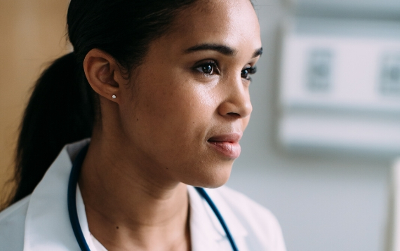 Close up on female doctor in hospital looking to the right