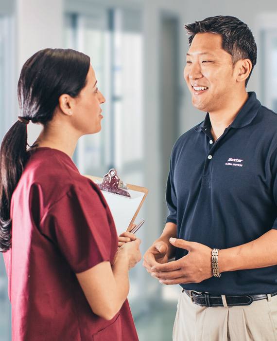 Baxter employee talking to a nurse