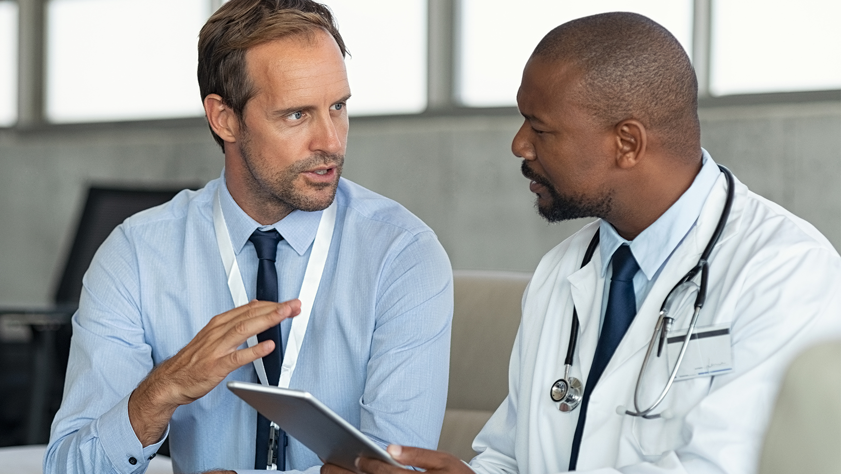 A clinician consults with their Baxter representative