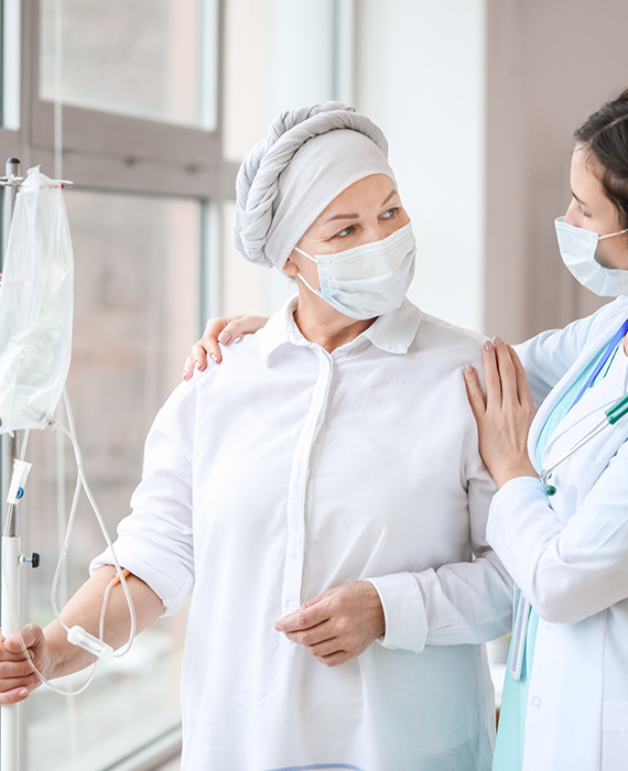 Doctor and woman in an oncology & infusion clinic setting