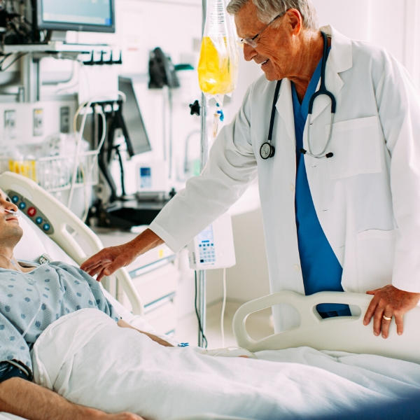 Doctor and patient in hospital with Spectrum IQ in background