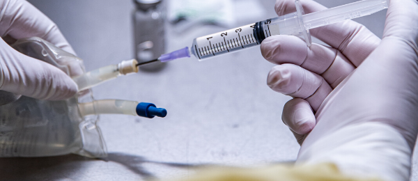 A hospital pharmacist prepared an IV medication by injecting drug into IV bag